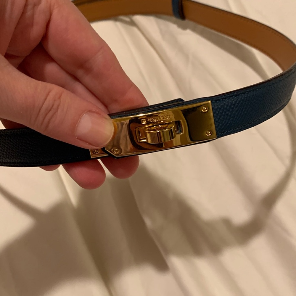Brand new thin trendy navy belt , adjustable size L 30 . Never been worn…